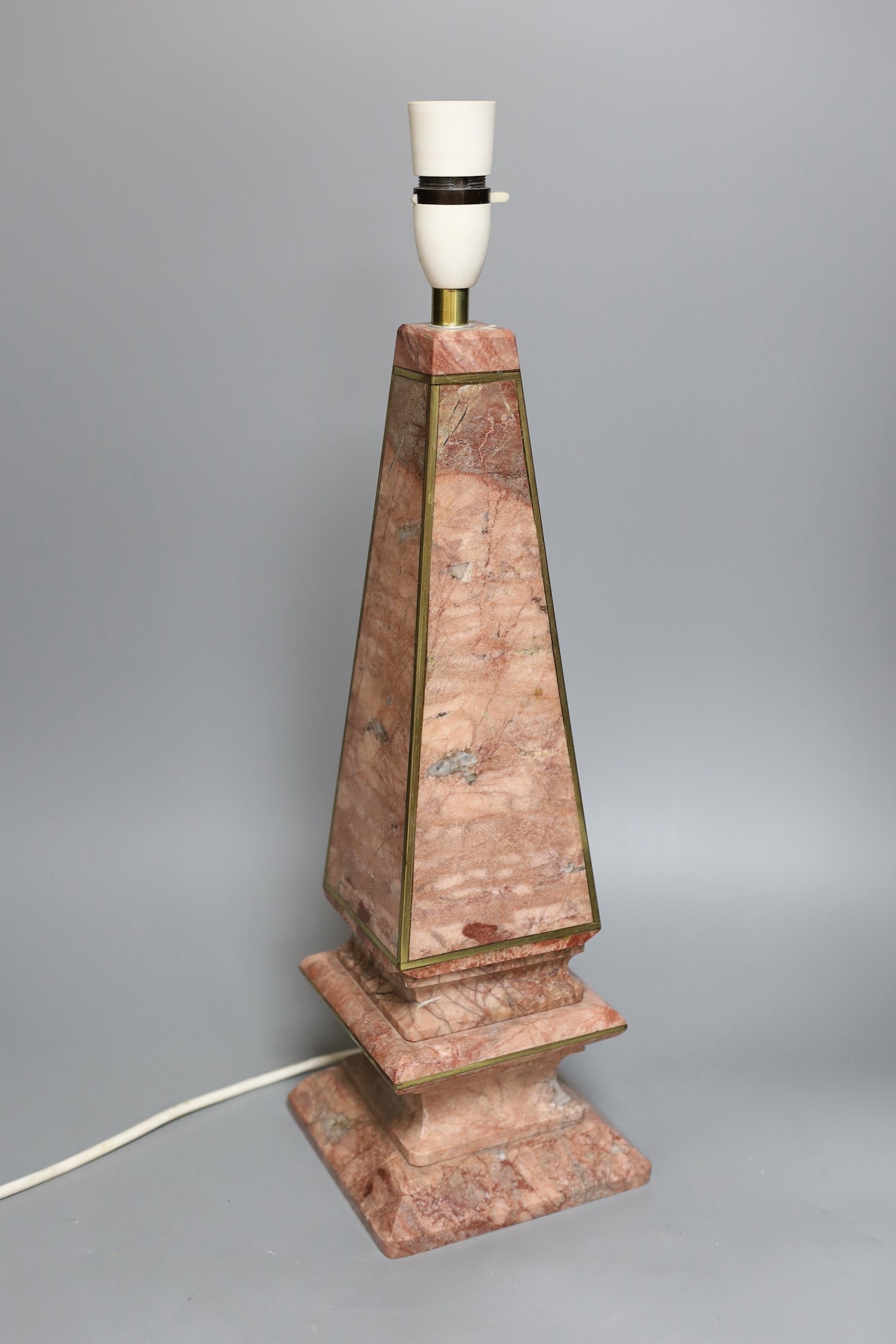 A single pink marble obelisk style desk lamp, 49cm tall